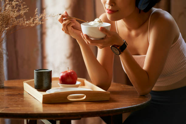 istock Woman eating granola 1135542286