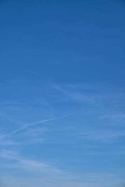 istock Blue sky with shade and vignette and sweeping clouds 1135542760