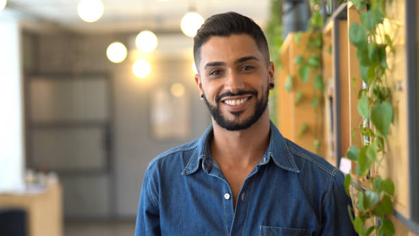 Latin businessman portrait standing at work studio