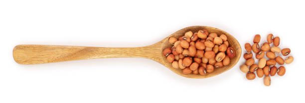 istock soybeans in wooden spoon isolated on white background top view 1135544032