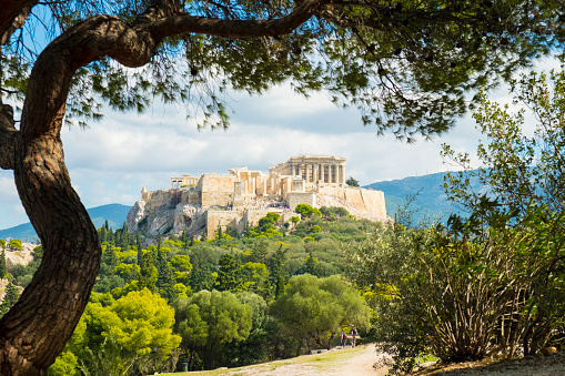 Framed view of the Parthenon at the Acropolis viewed from Filopappou Hill in Athens, Greece. Horizontal