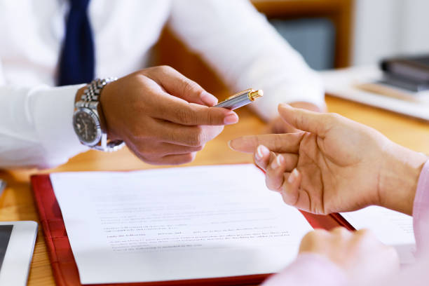 istock Estate agent offering pen 1135544511
