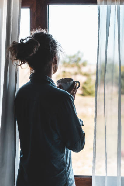 istock Silhouette of a woman drinking coffee 1135547015