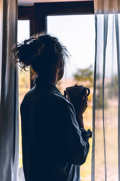 istock Silhouette of a woman drinking coffee 1135547289