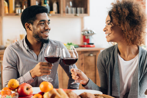 istock African-american couple enjoying romantic dinner at home 1135547518
