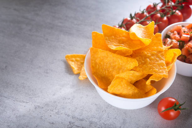 istock Tomato salsa with golden tortilla chips 1135549471