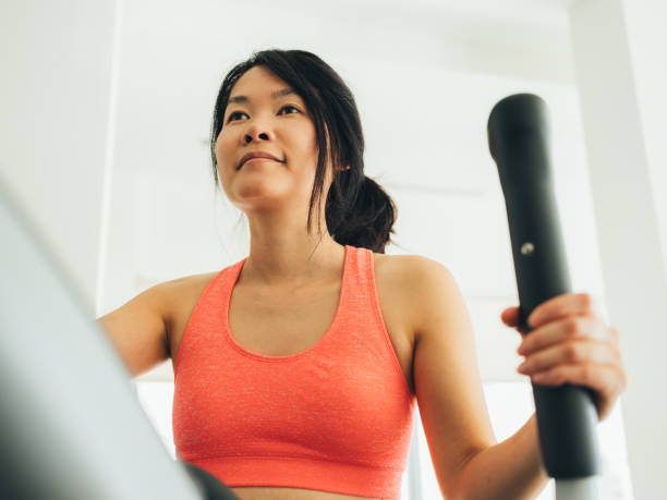istock Young Asian woman working out 1135549530