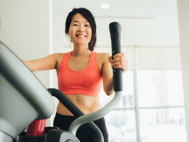 istock Young Asian woman working out 1135549771