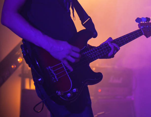 istock Electric bass guitar player on a stage 1135550629