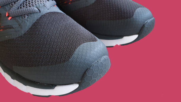 istock Grey trainers on wooden background 1135550722