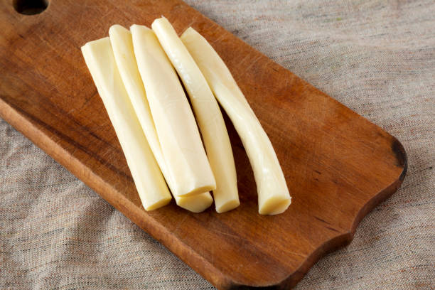 istock String cheese on rustic wooden board, side view. Healthy snack. 1135555140