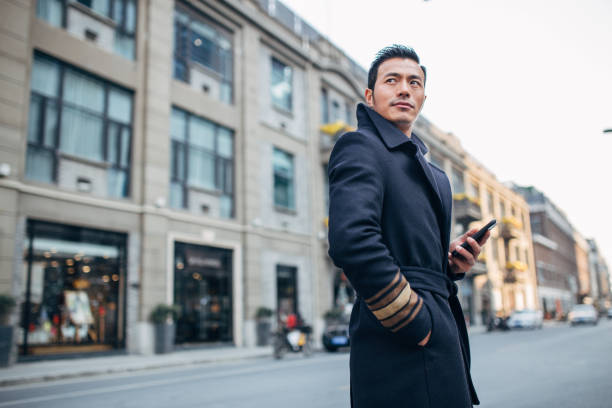 istock Man with phone outdoors 1135555788
