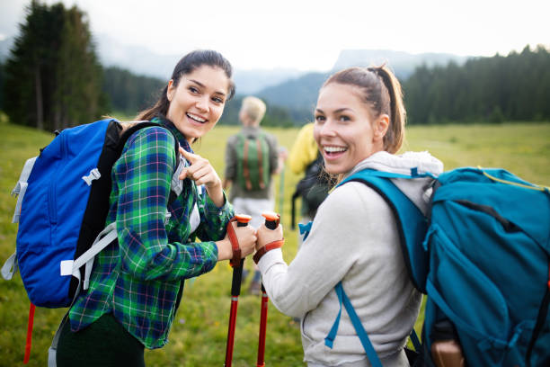 istock Four happy friends are looking on mountains and having fun together 1135559855