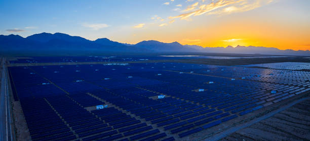 istock Aerial solar photovoltaic panel at sunset 1135562832