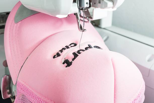 Embroidered cap and embroidery machines close up picture