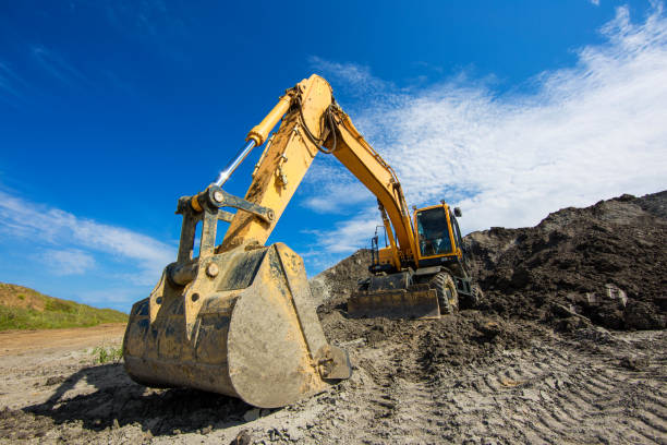 istock Excavator bucket on clay mining site. Wide angle 1135564913