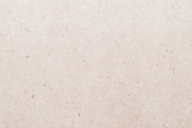 istock Particle pressed wood panel OSB - oriented strand board texture background n light brown beige cream sepia color 1135565408
