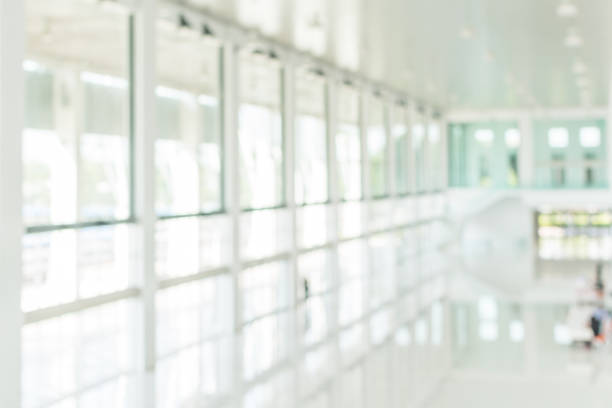 istock Office building blur background business lobby reception hall interior or empty indoor foyer meeting room with blurry light from glass wall window 1135565480