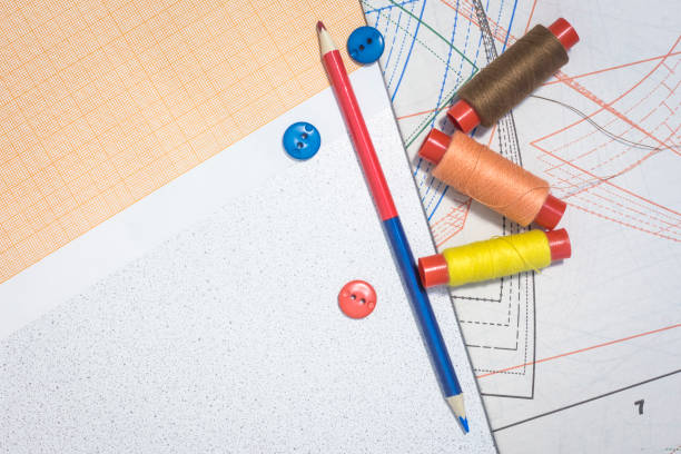 istock sewing thread with buttons on the table fashion designer clothes.copy space 1135566877