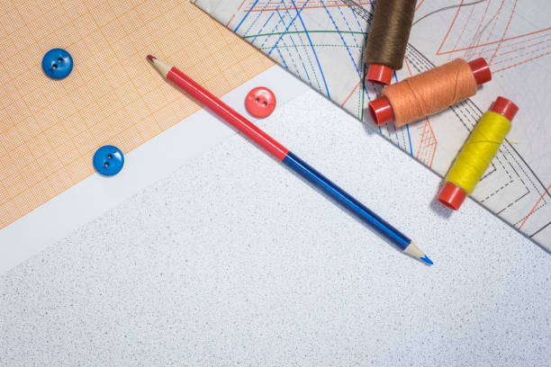 istock sewing thread with buttons and pencil on the table fashion designer clothes.copy space 1135567011
