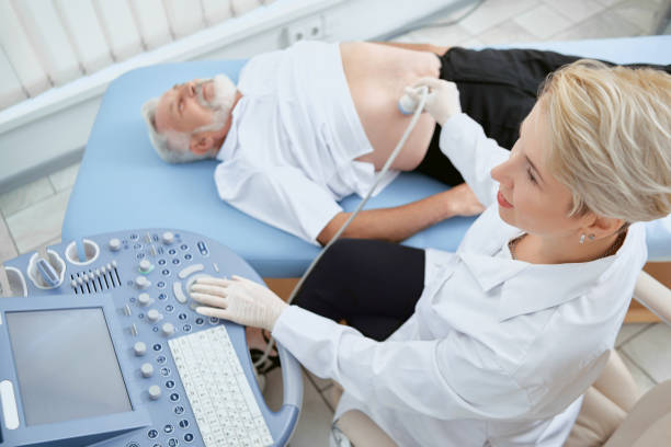 doctor providing exam with modern med equipment. - attentively imagens e fotografias de stock