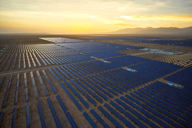 istock Aerial tilting automatic rotating bracket for solar photovoltaic panel at sunset 1135567572