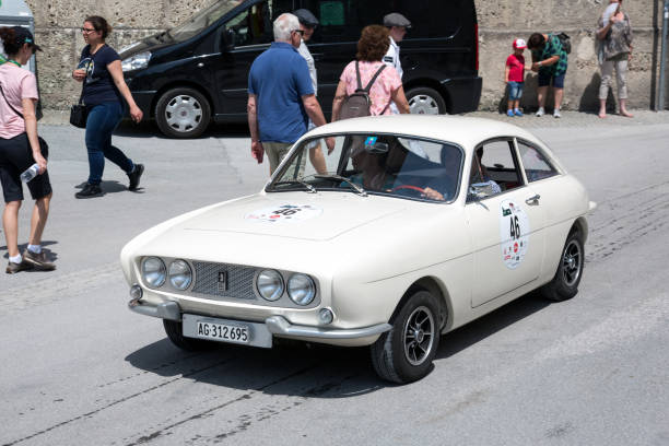 Classic Ogle at the Gaisberg race in Salzburg, Austria Salzburg / Austria - May 2018. Beautiful white 1963 Ogle SX 1000 arriving at the finish in the center of Salzburg during the historic Gaisberg Classic Race. The Gaisberg road became the venue of a car and motorcycle hillclimb race between 1929 and 1969, which was part of the European Hillclimb Championship. gaisberg stock pictures, royalty-free photos & images