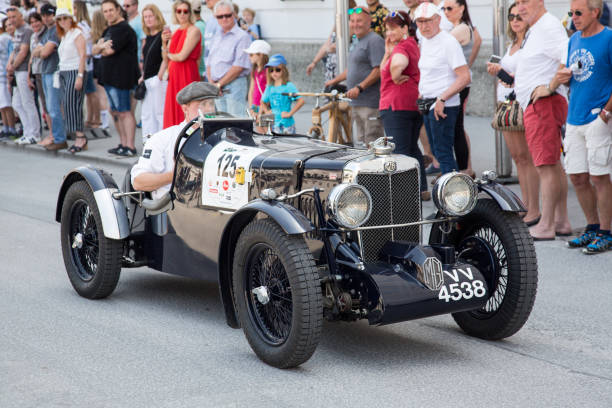 Classic MG at the Gaisberg race in Salzburg, Austria Salzburg / Austria - May 2018. Beautiful 1935 MG Compressor arriving at the finish in the center of Salzburg during the historic Gaisberg Classic Race. The Gaisberg road became the venue of a car and motorcycle hillclimb race between 1929 and 1969, which was part of the European Hillclimb Championship. gaisberg stock pictures, royalty-free photos & images