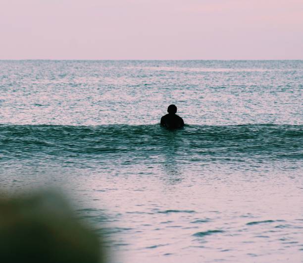 istock Surfer waiting in the water 1135570834