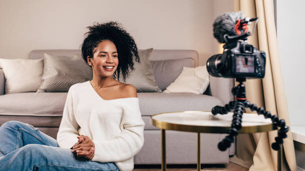 istock Smiling woman creating video content for her blog 1135574057