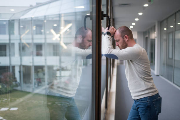 istock Young male businessman thinking outside his office 1135575421