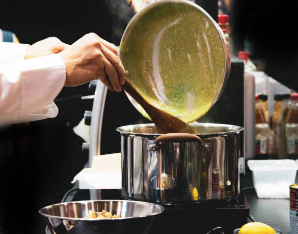 istock Chef preparing food, meal, in the kitchen, chef cooking, Chef decorating dish 1135576059