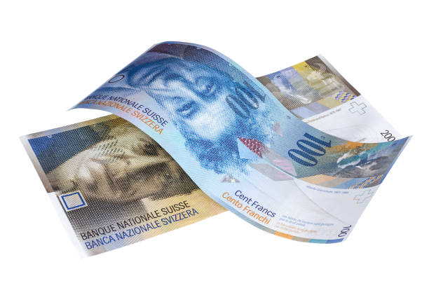 istock One and two hundred Swiss Franc banknotes on white surface 1135577473