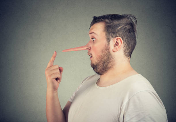 istock Side profile of a shocked liar man with long nose 1135580163