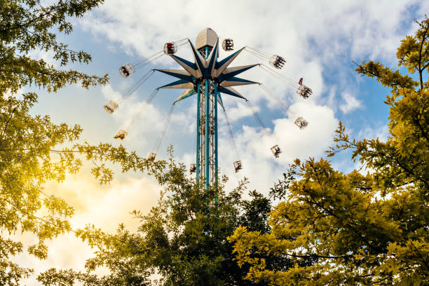 Villach, Austria - July 30, 2025: Amusement ride at Villacher Kirchtag festival, featuring colorful design and thrilling experience under a cloudy sky