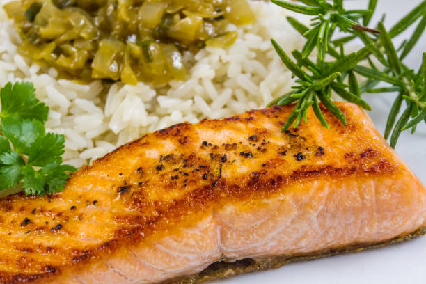 istock Grilled salmon and rice with onion sauce 1135582893