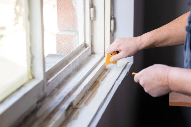 istock Senior man sanding old window frame in his apartment 1135586621