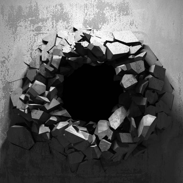 istock Dark cracked broken hole in concrete wall 1135586717