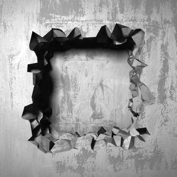 istock Dark cracked broken hole in concrete wall 1135586996