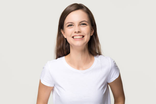 istock Happy cheerful girl looking at camera isolated on background 1135587126