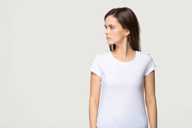 istock Confident young woman looking forward at copyspace isolated on background 1135587140