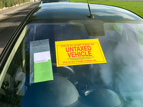 Untaxed vehicle notice adhered to a car windscreen - UK