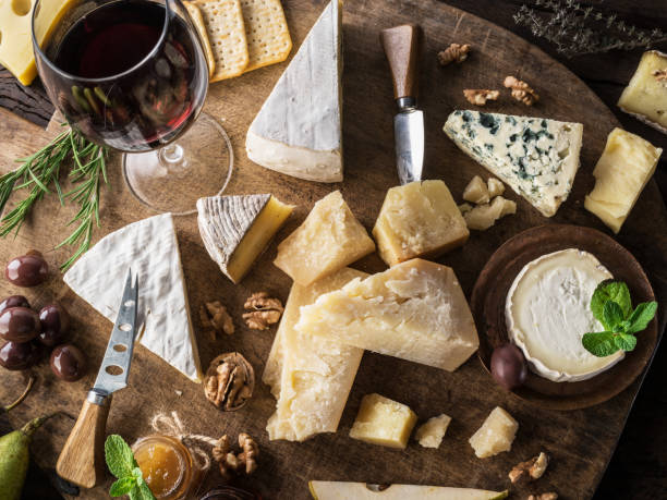istock Cheese platter with organic cheeses, fruits, nuts and wine. 1135592180