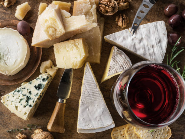 istock Cheese platter with organic cheeses, fruits, nuts and wine. 1135592342