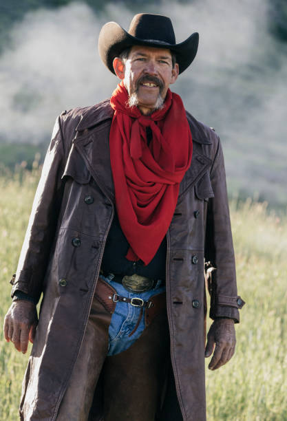 istock A cowboy walking in a field. 1135595485