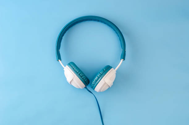 istock Headphones with pastel blue background 1135596579