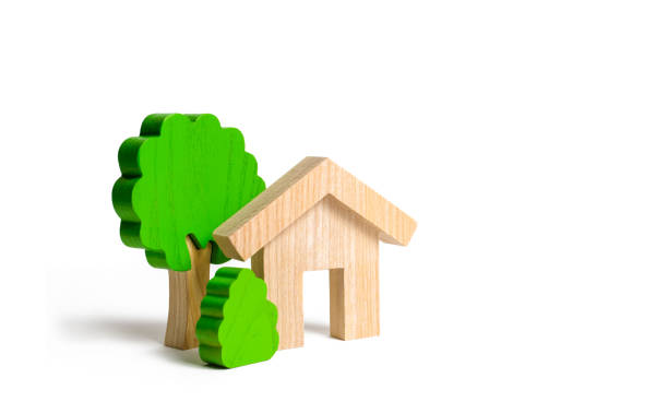 istock Wooden house and trees. Environmentally friendly and environmentally friendly home. Modern technology in construction. Quiet and cozy, comfortable affordable housing. Housing in the suburbs. 1135597682