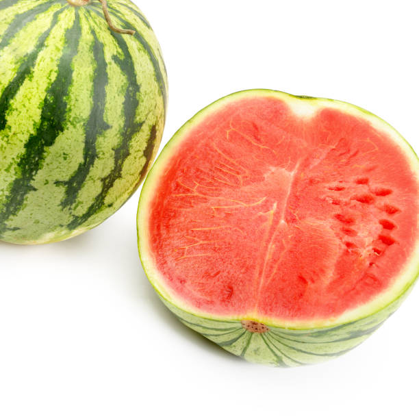 istock Ripe round watermelon and half a berry isolated on white background. 1135597706