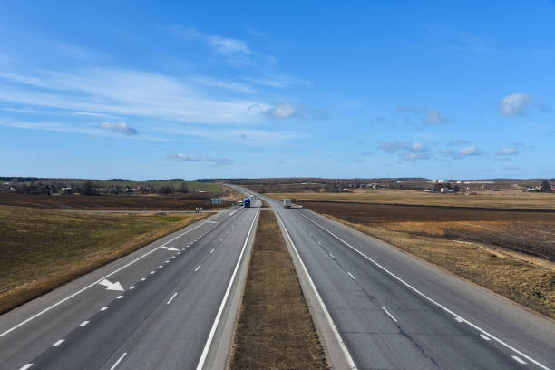 istock Highway with freight tracks in early spring in Europe 1135597935
