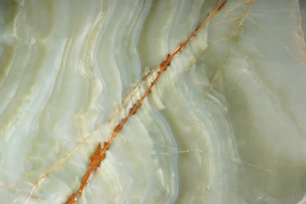 istock Natural green onyx stone with a red stripe on the surface 1135599015